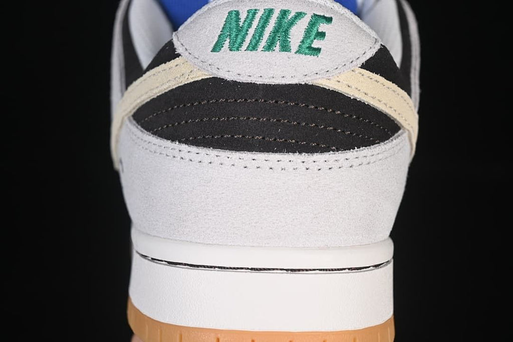 Rear view highlighting the heel panel, stitching, and gum outsole.