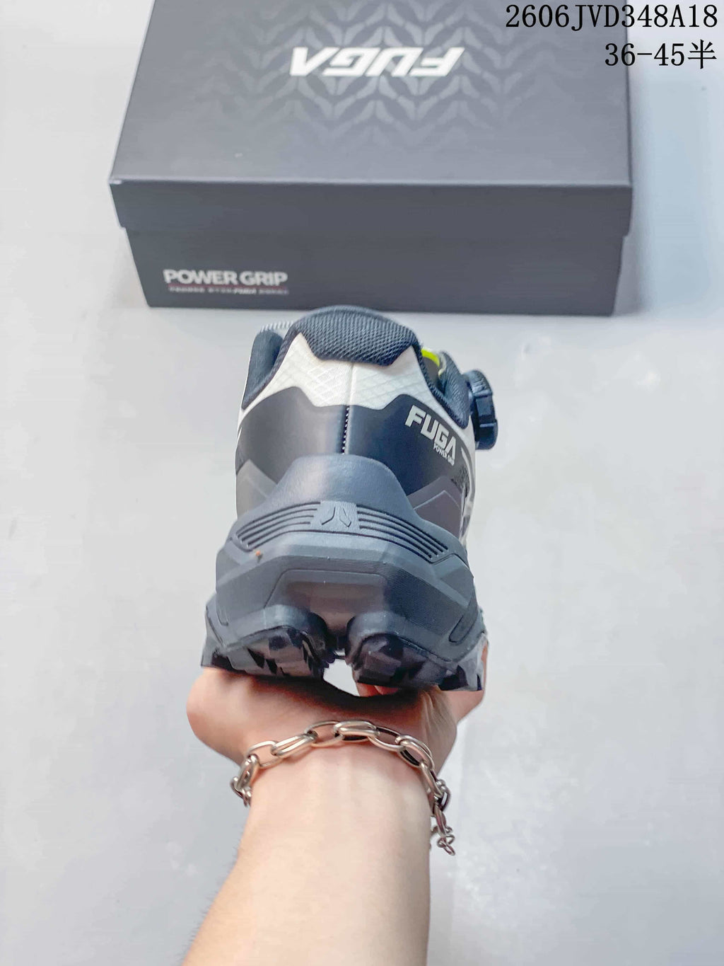 Rear view of a Kailas FUGA EX3 shoe showing its heel construction and dark outsole.