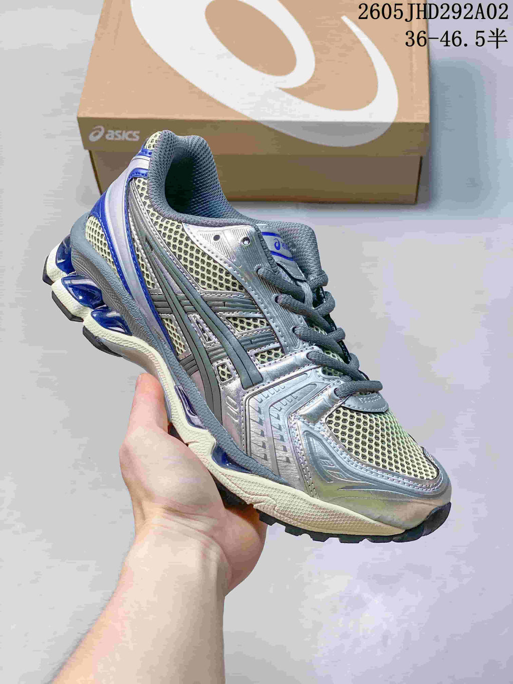 ASICS GEL-KAYANO 14 sneaker in silver and pale tones with blue accents