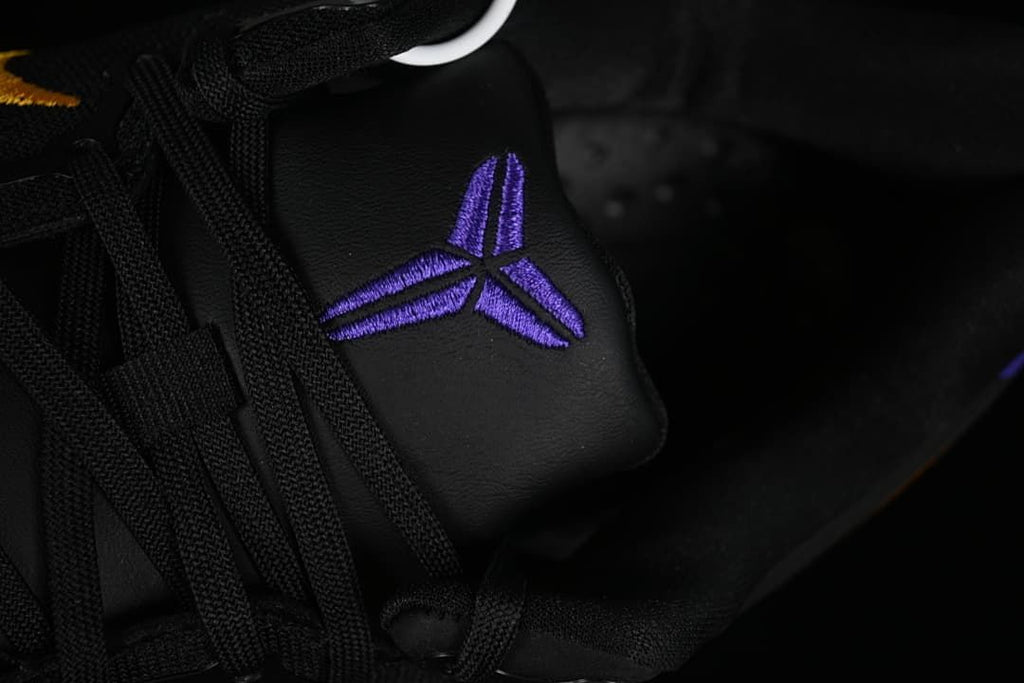 Close-up of purple Kobe logo on the tongue