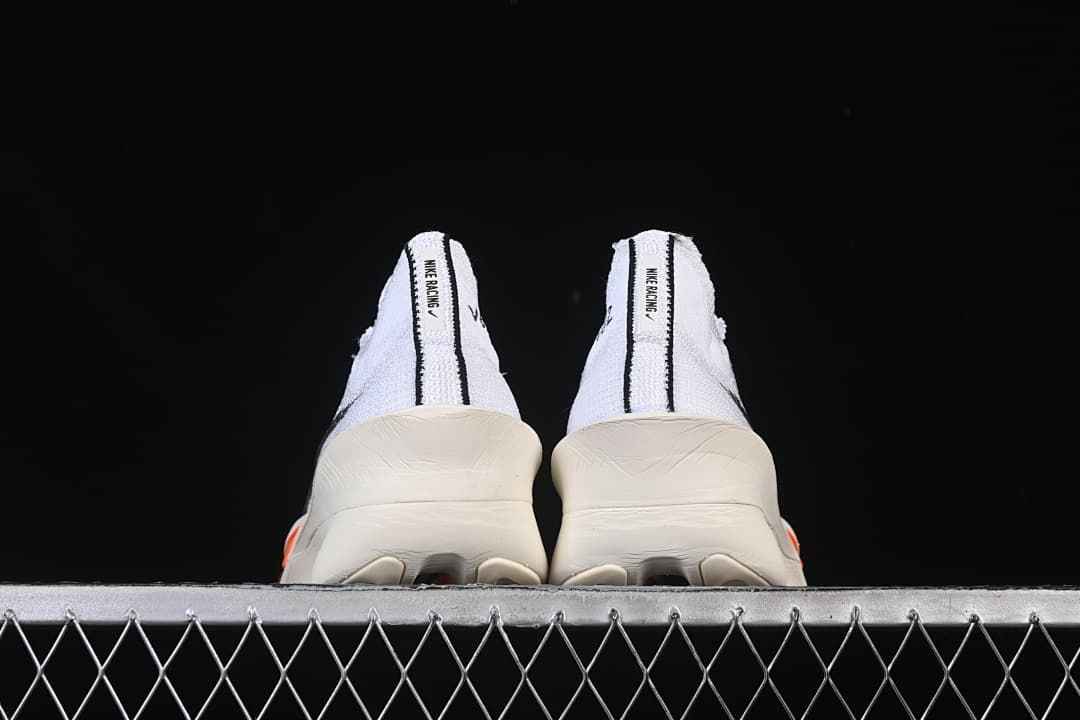 Rear view of both sneakers with dark heel stripes