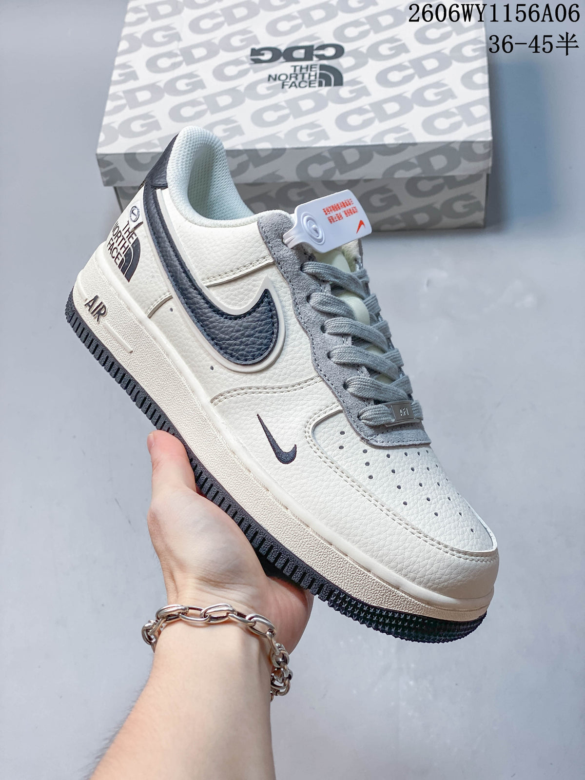 Angled close-up of an off-white Nike Air Force 1 '07 Low sneaker with gray laces and navy accents.