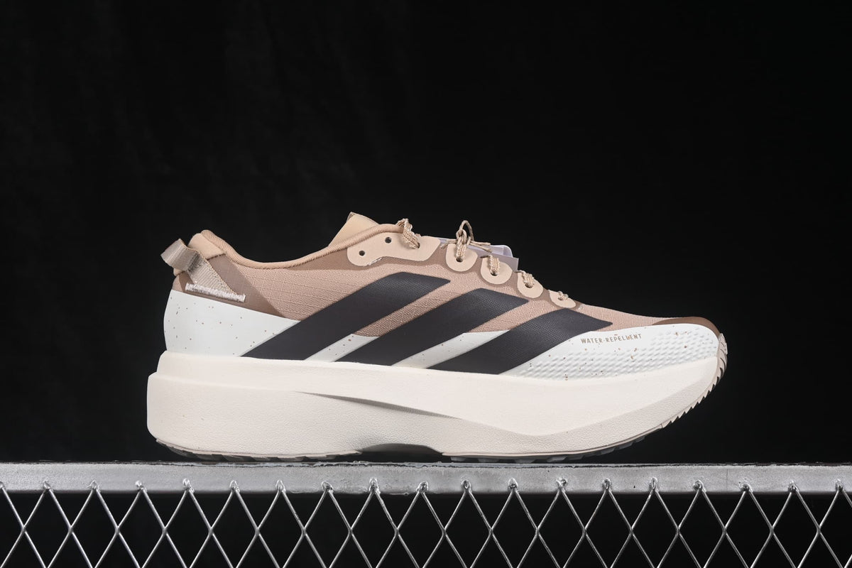Side profile of the beige Adidas Adizero Evo SL running shoe with black stripes, cream midsole and textured forefoot panel.