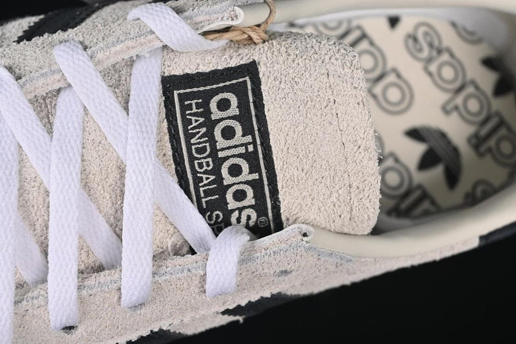 Close-up of the tongue label and white laces
