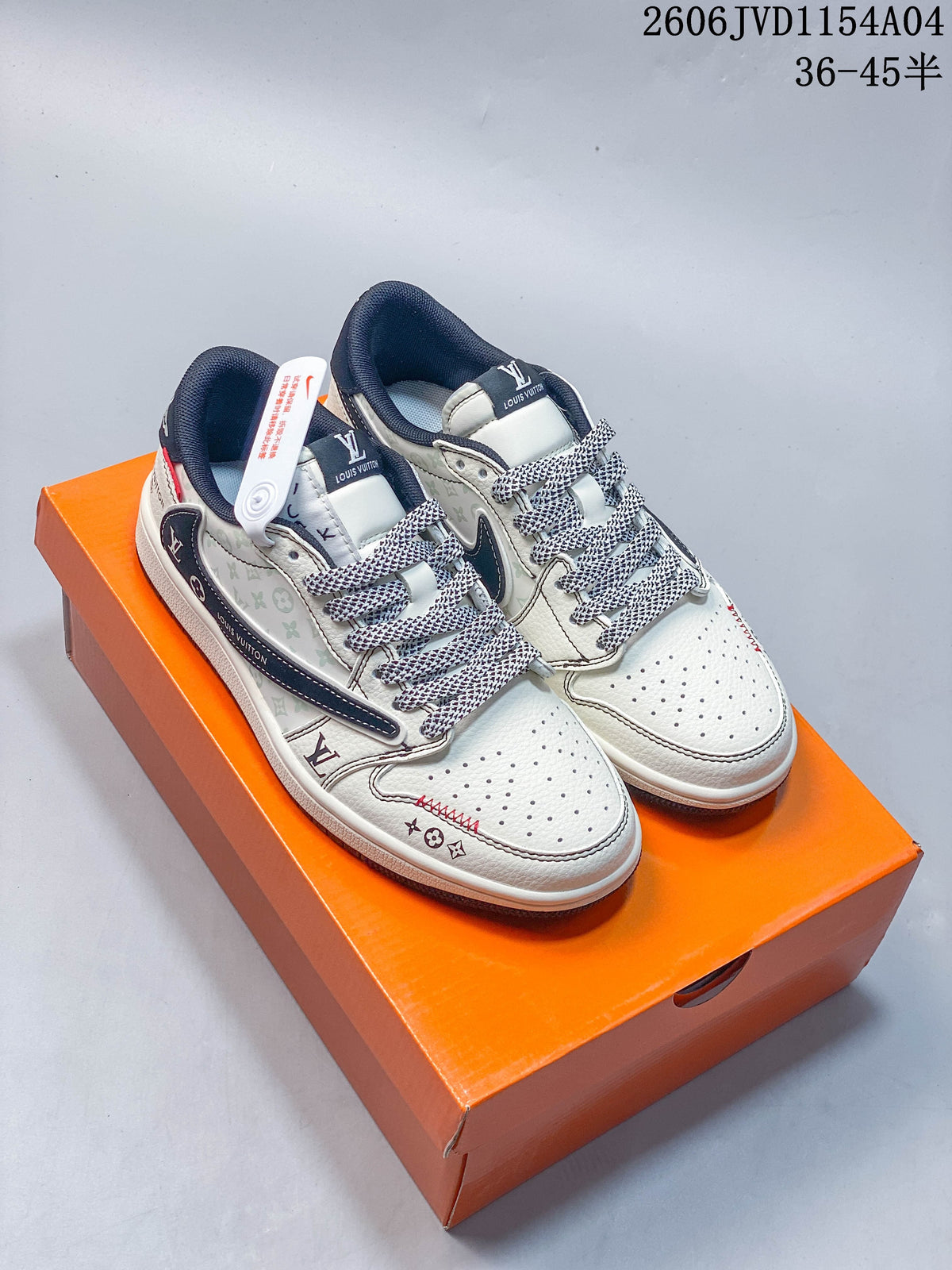 Pair of white low-top sneakers with dark blue details and patterned laces, photographed on an orange box.