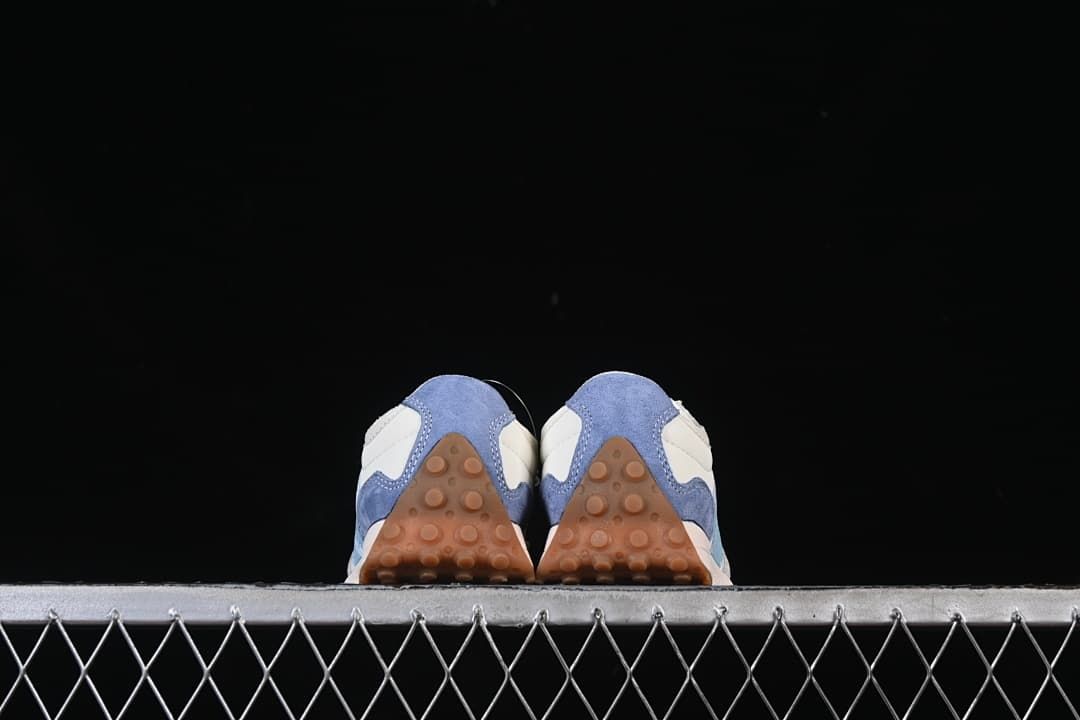 Rear view of the pair showing the blue heel panels and gum-colored outsoles.
