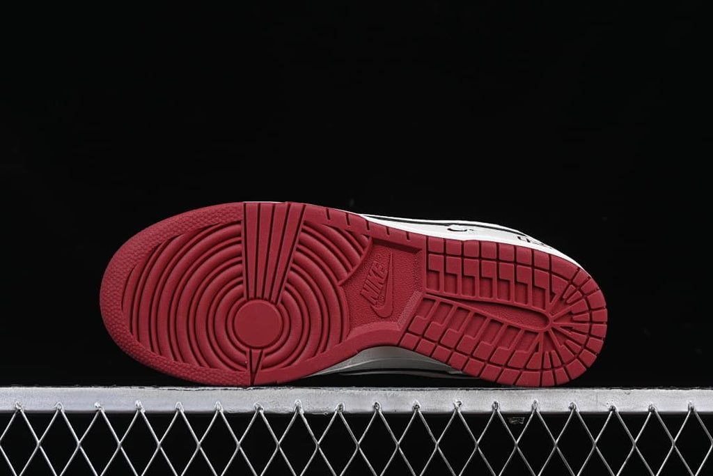 Underside view showing the burgundy rubber outsole tread
