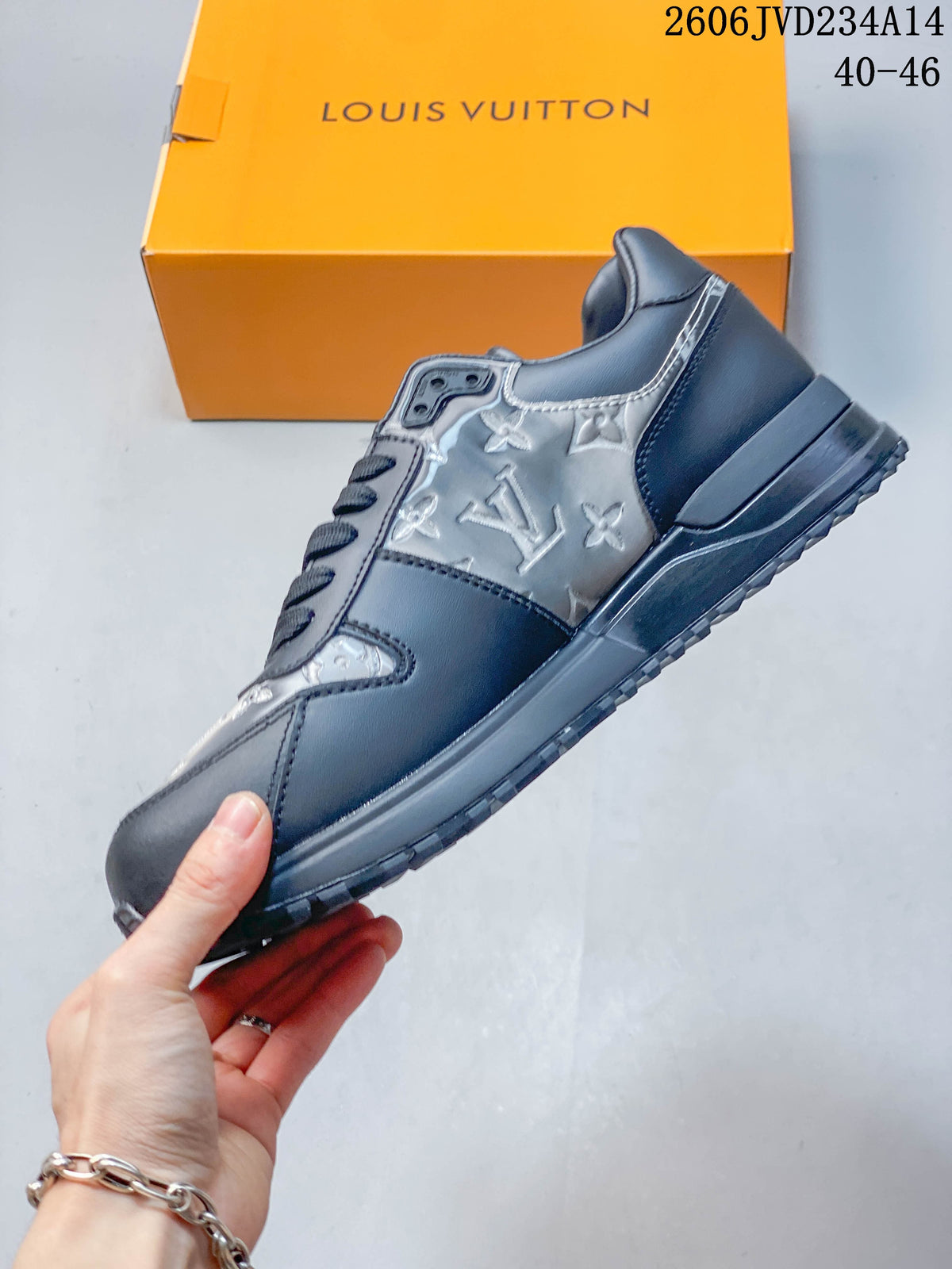 Side view of the gray low-top sneaker with patterned panels and a chunky sole