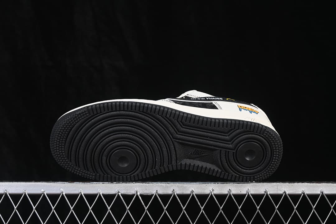 Underside view showing the black circular-patterned outsole