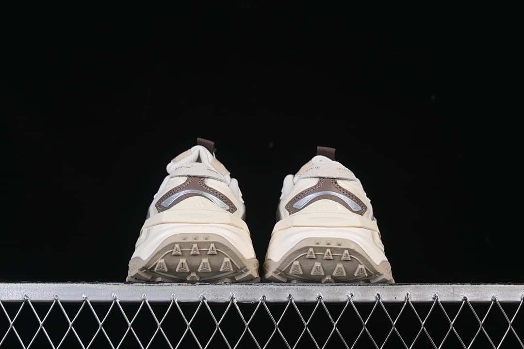 Rear view of both sneakers showing the heel panels and outsole edges.