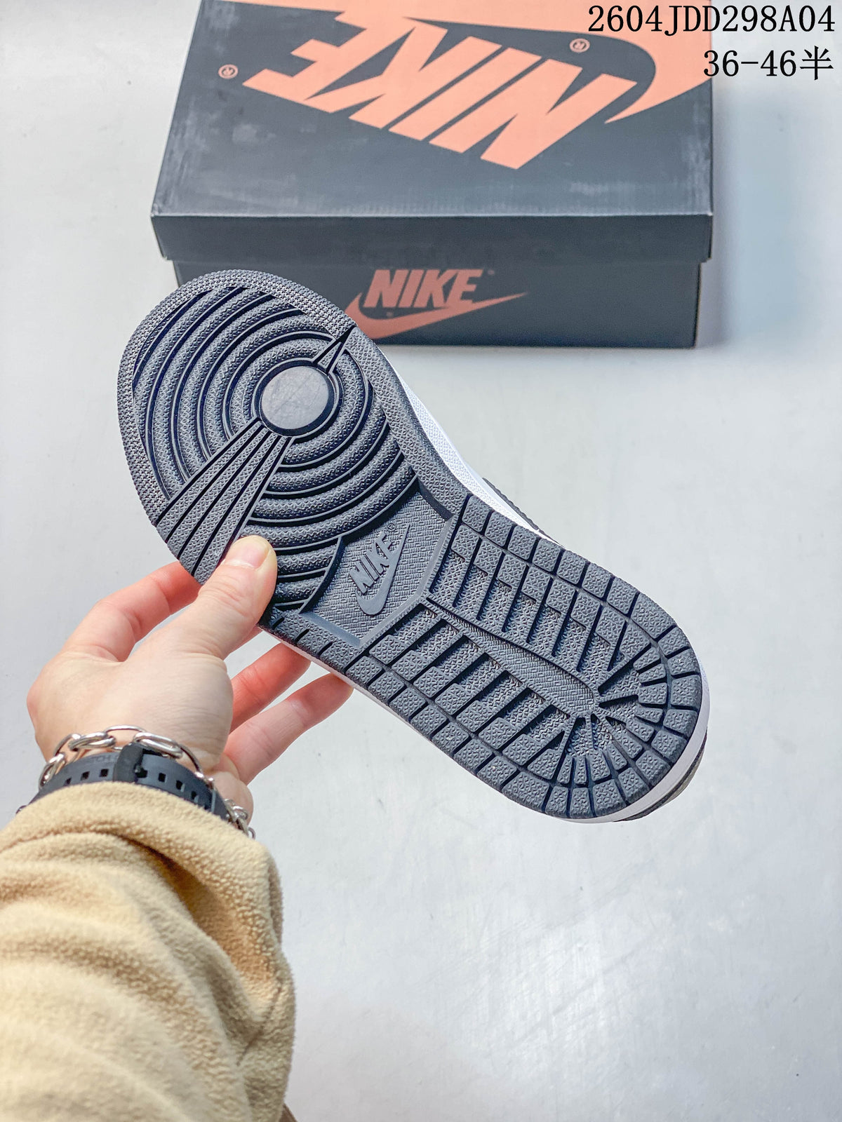 Close-up of the dark patterned outsole on a Jordan AJ1 Low sneaker