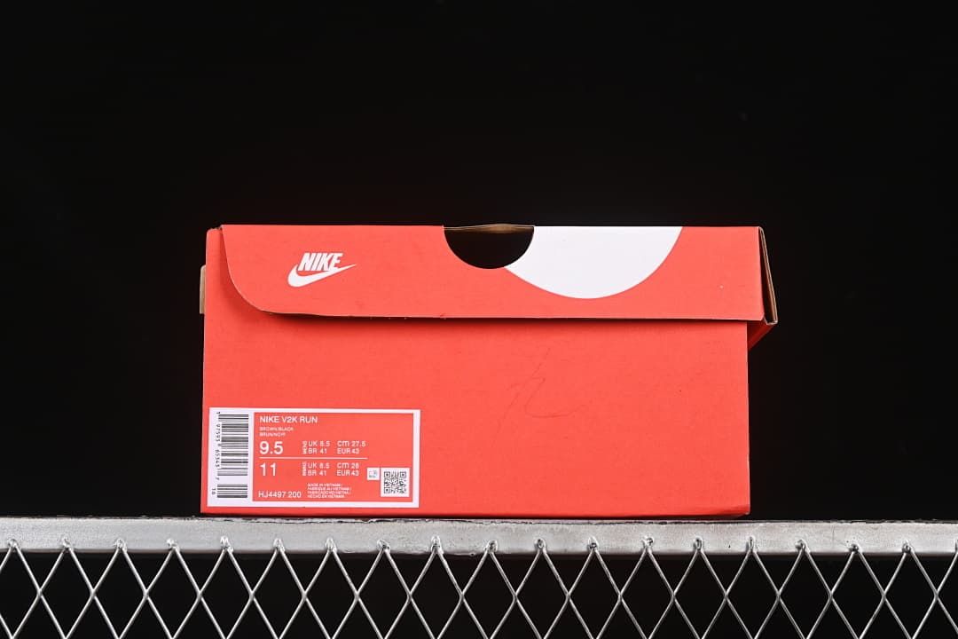 Shoe box label identifying the Nike V2K Run and style code HJ4497-200