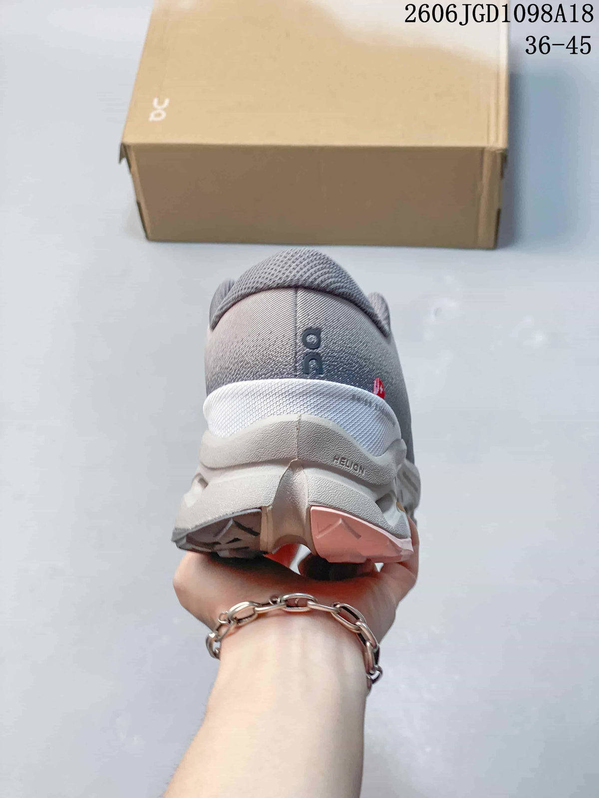 Rear view of a gray Cloudmonster 3 sneaker showing the heel and sculpted sole