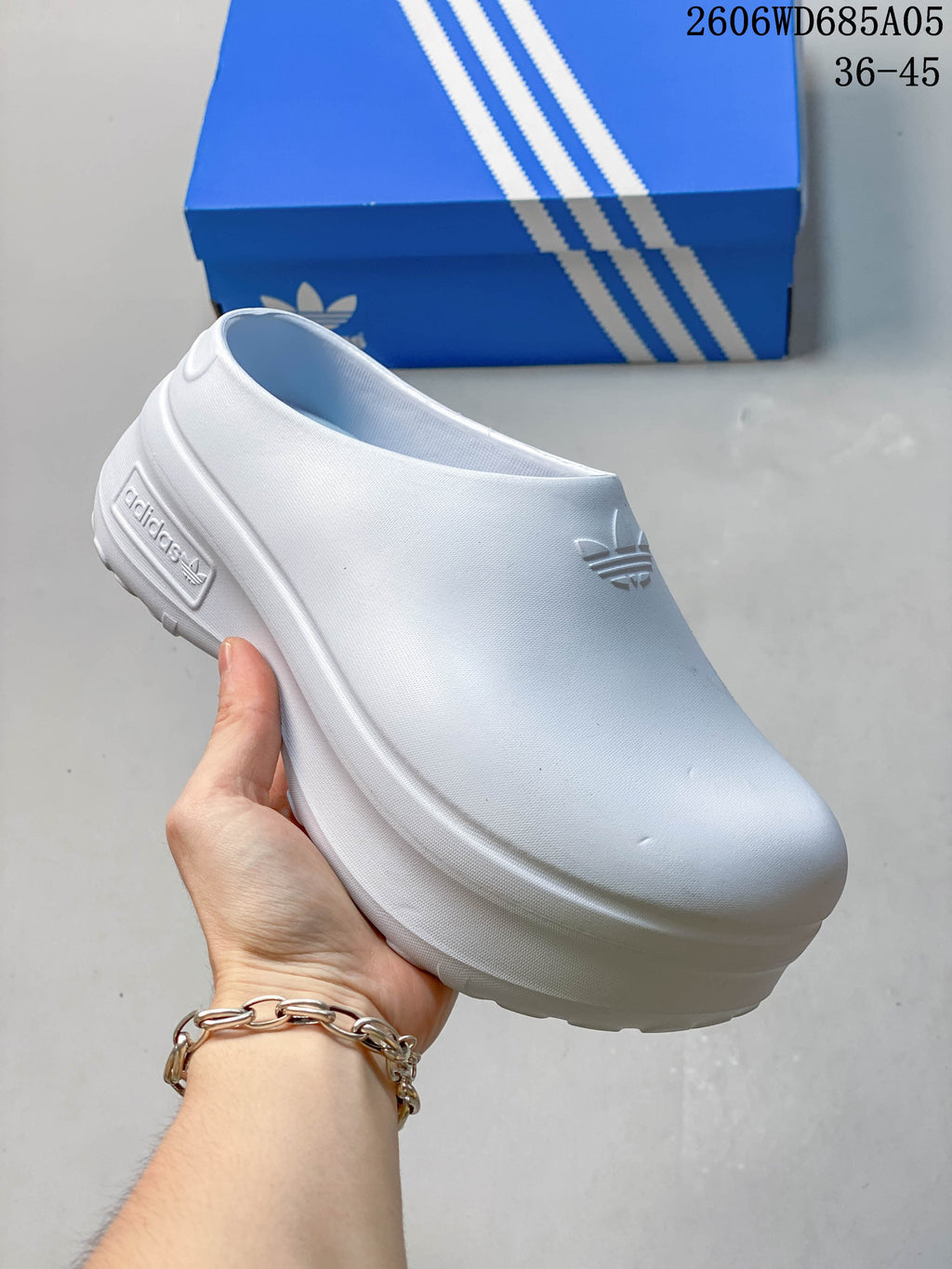 Bright lime Adidas mule clog with a raised platform sole