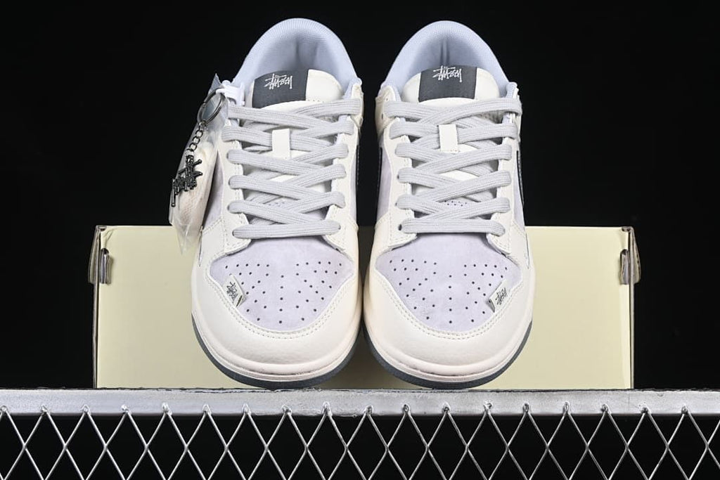 Front view of both sneakers showing perforated toes and lace-up fronts