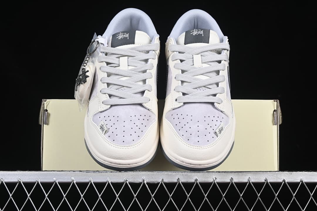 Front view of both sneakers showing perforated toes and lace-up fronts