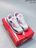 Pair of white, gray, black, and pink Nike Air Max 90 sneakers on a red shoebox