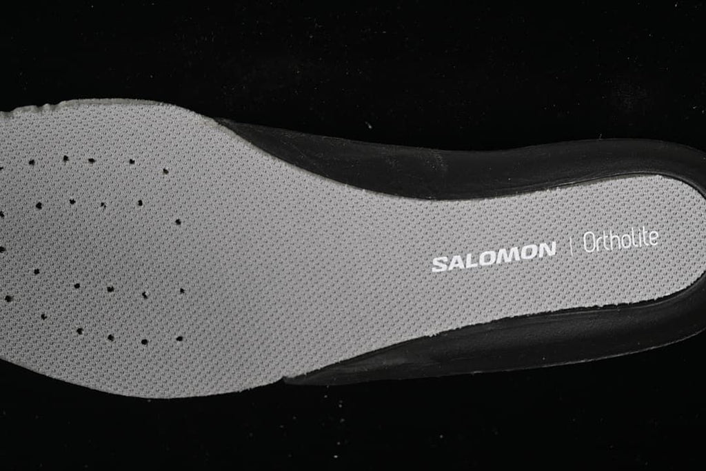 Close-up of the gray Salomon Ortholite insole.