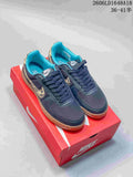 Pair of dark navy Nike Field General 82 SP low-top sneakers with leopard-print Swooshes, turquoise lining, and gum-colored soles
