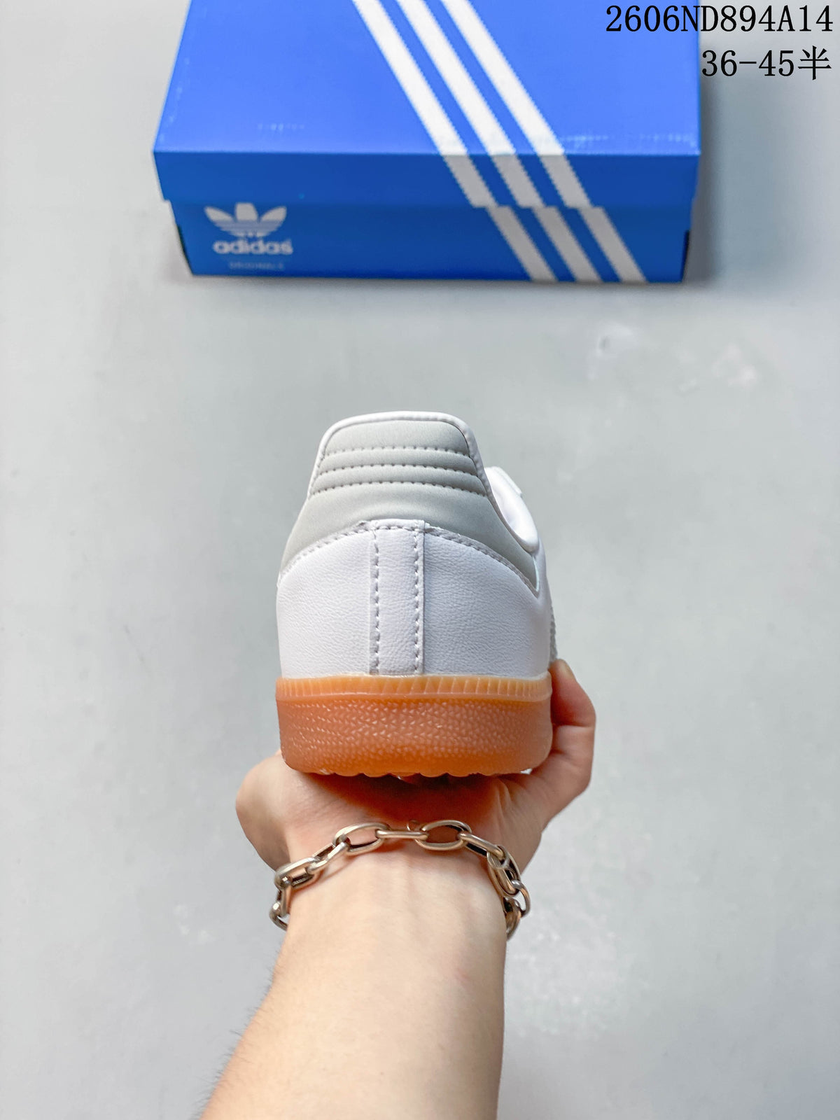 Rear view of the white adidas Samba sneaker with a gum-colored sole