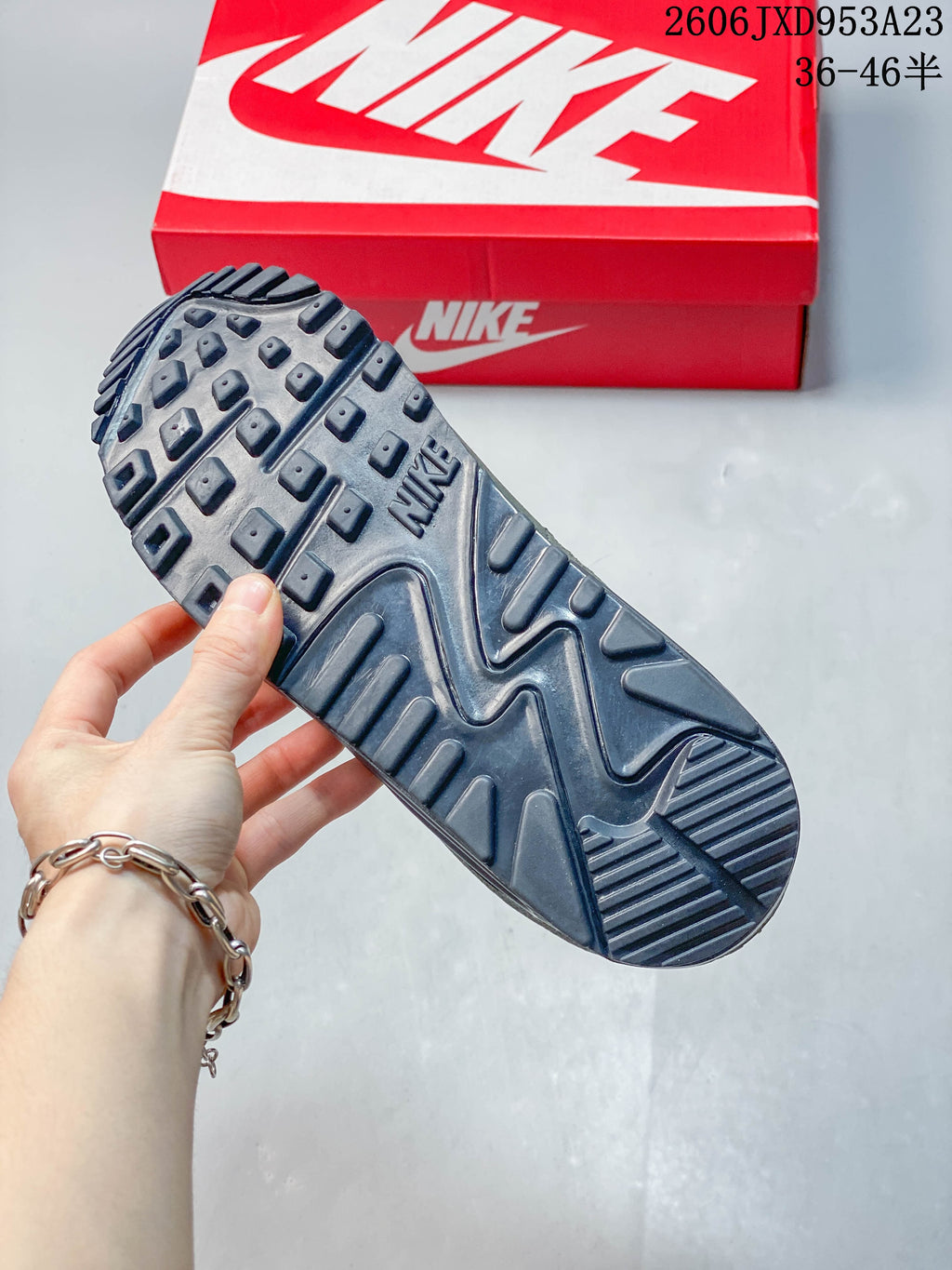 Underside of the Nike Air Max 90 showing its dark tread pattern