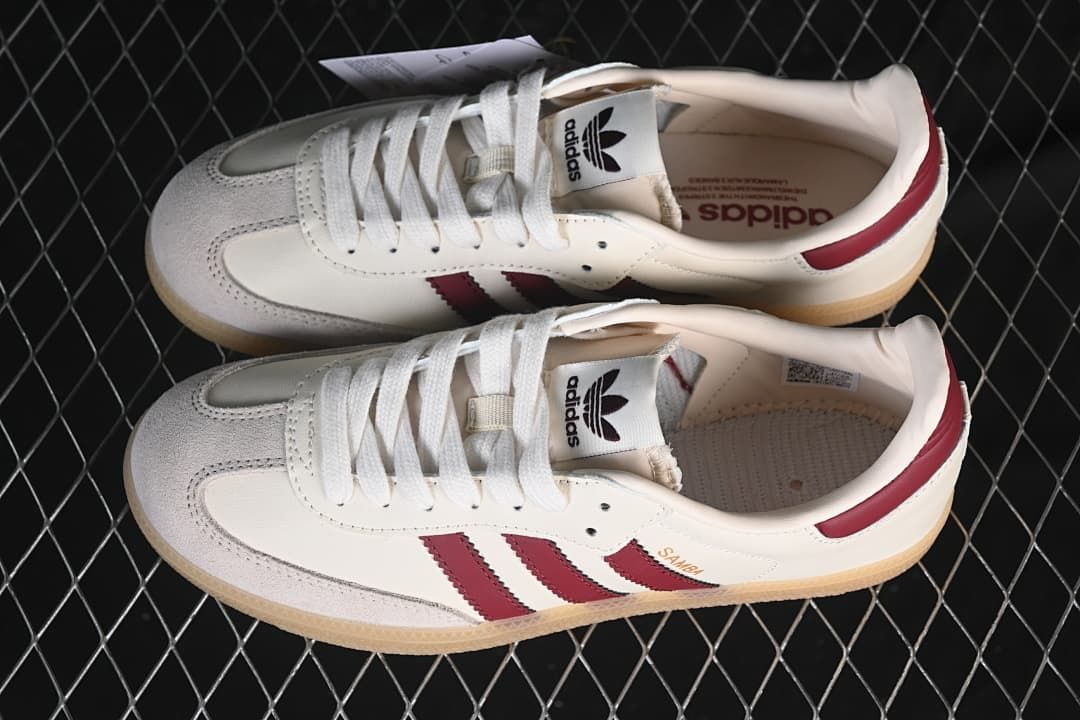 Overhead view of the pair of cream and burgundy Samba sneakers.