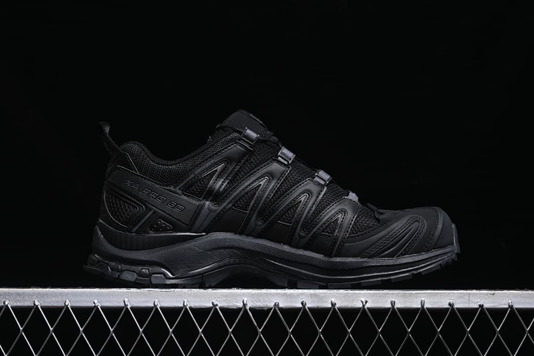 Side profile of the black XA Pro 3D shoe with its lacing and outsole visible