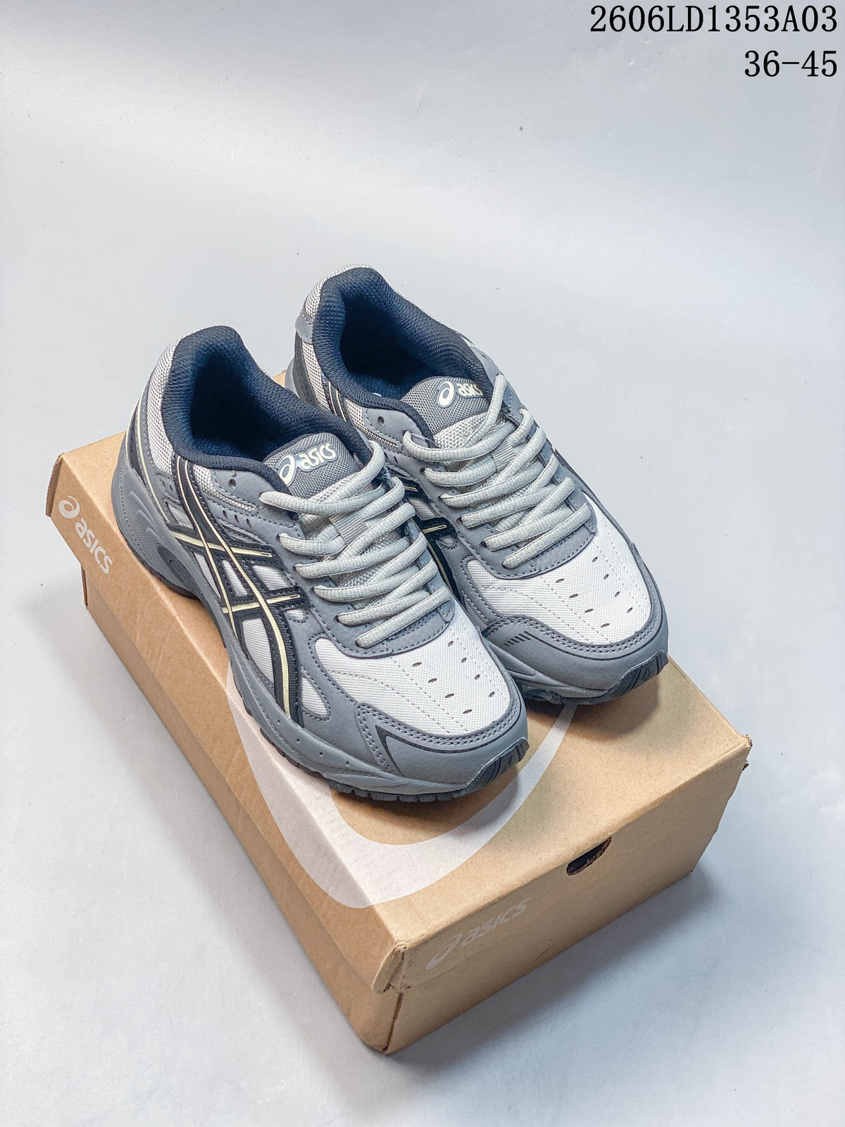 Grey ASICS GEL-170TR sneakers shown from above on a shoe box.