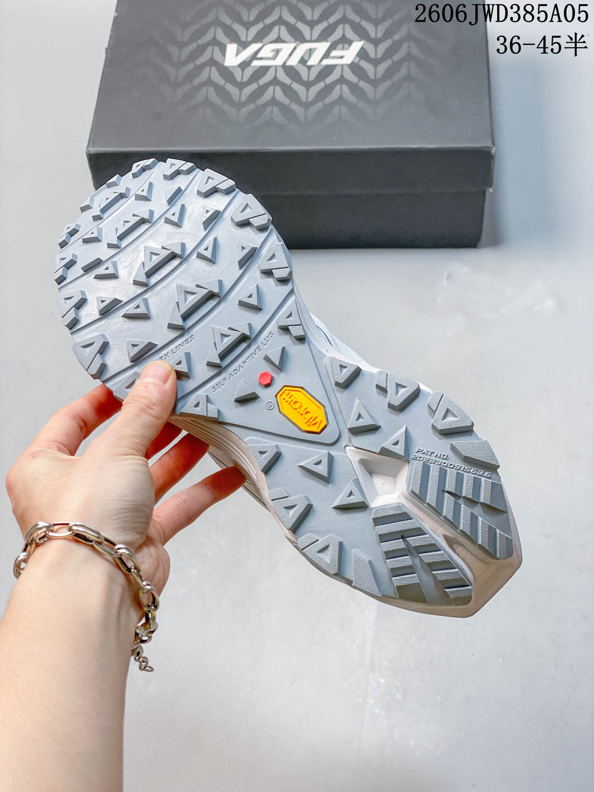 Close-up of the Kailas shoe outsole showing deep trail tread and Vibram marking