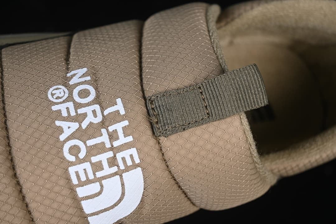 Close-up of the branded instep strap and pull tab