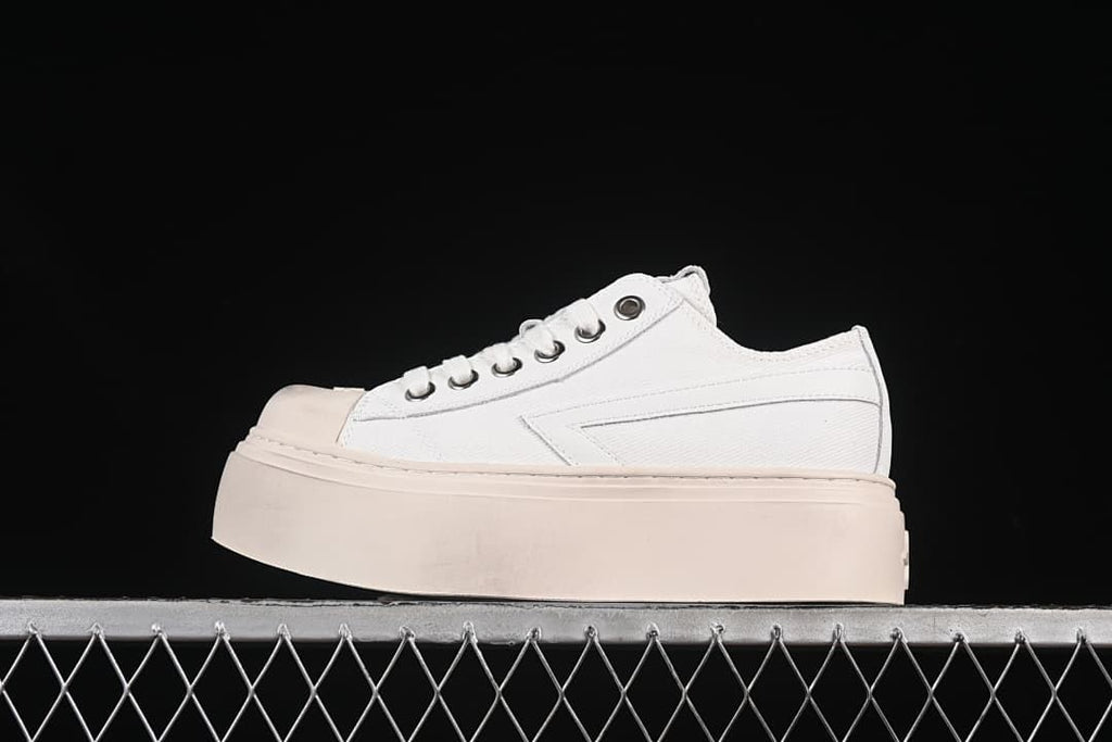 Side view of a white SMFK low-top sneaker with a thick pale platform sole.