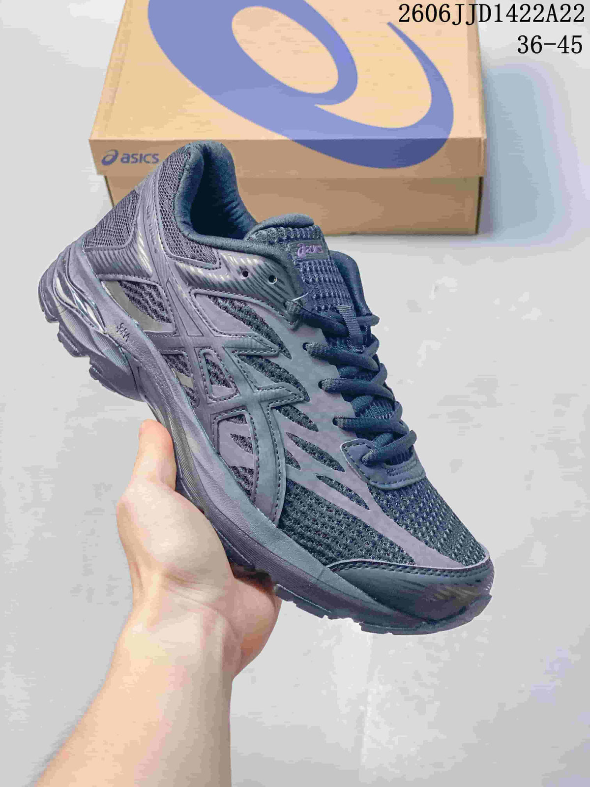 Dark gray ASICS GEL-FLUX running shoe, angled side view.