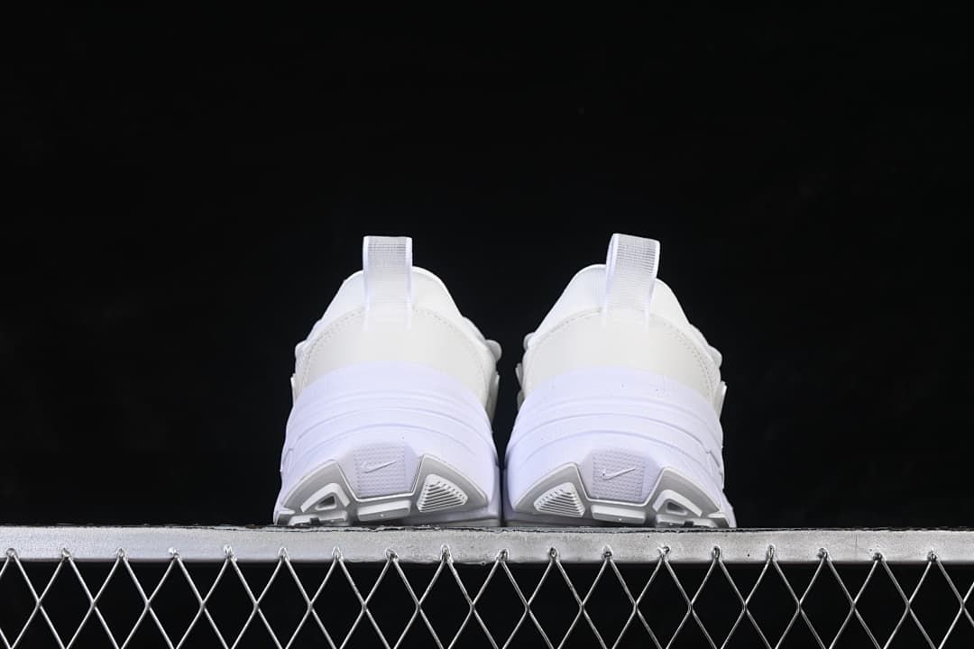 Rear view of the pair showing heel pulls and outsole details