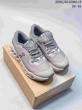 Pair of gray and pale pink On Cloudmonster 3 sneakers displayed on a box