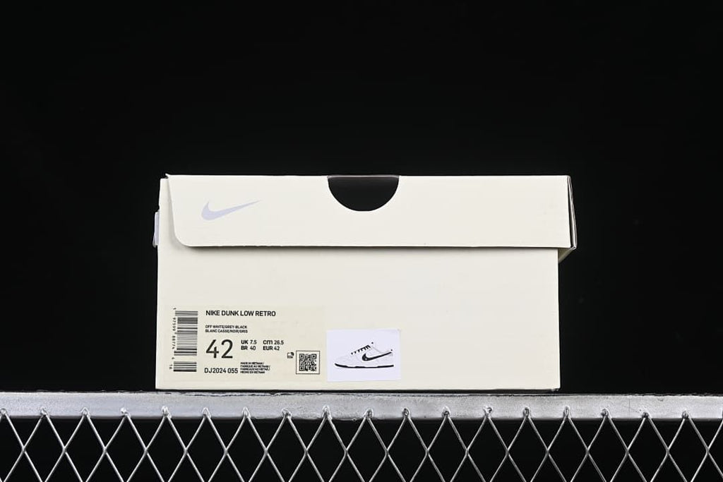 Shoe box label identifying Nike Dunk Low Retro, style code DJ2024-055, and size 42