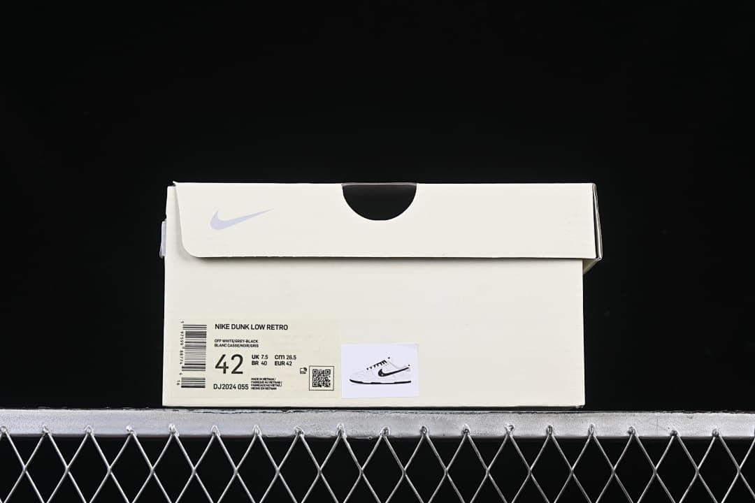 Shoe box label identifying Nike Dunk Low Retro, style code DJ2024-055, and size 42