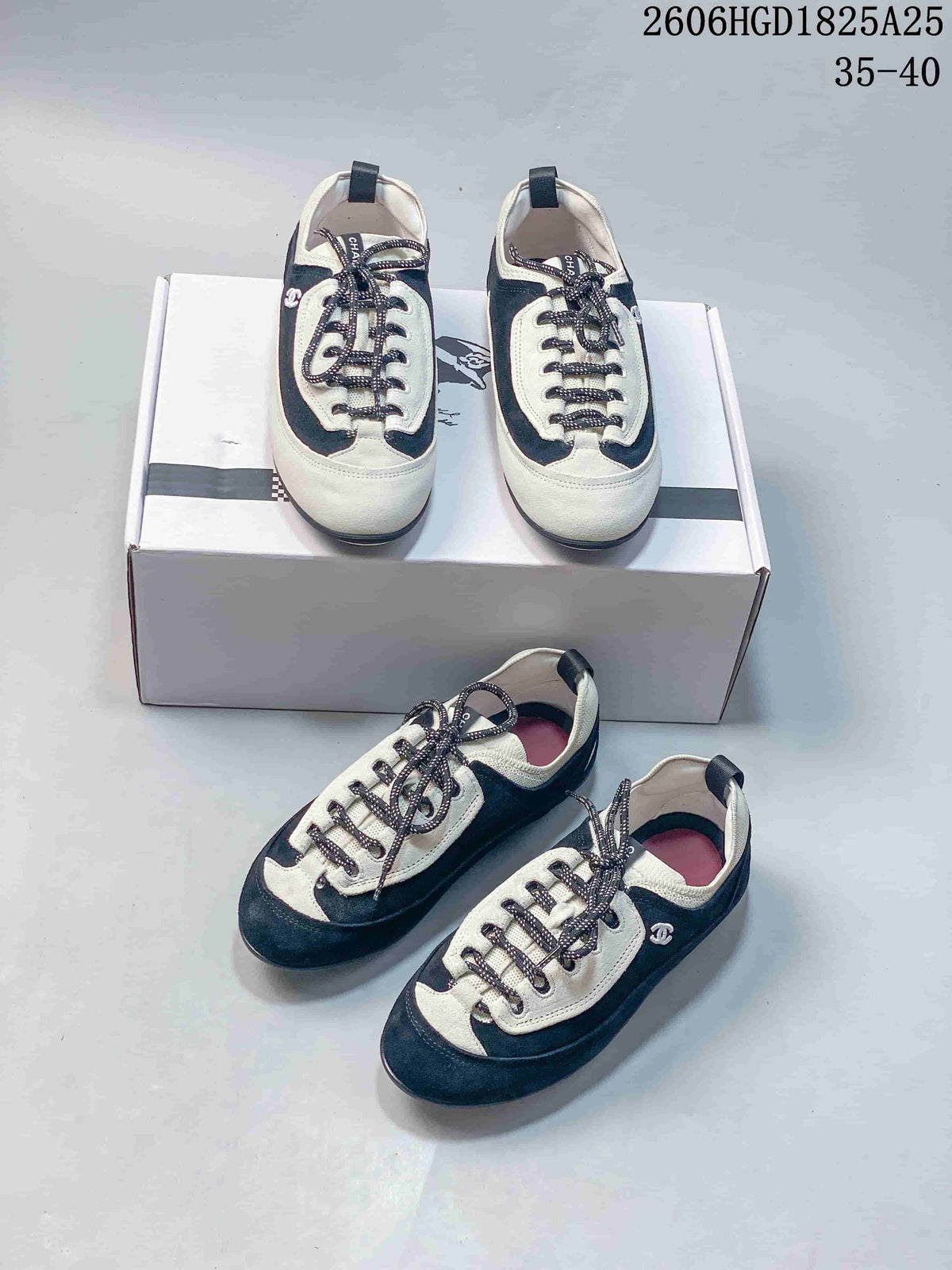 Several views of black and ivory low-top trainers with speckled laces.