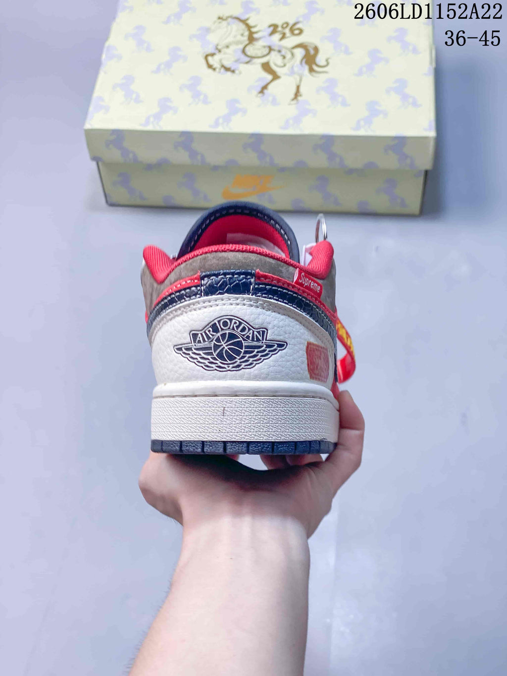 Rear view showing the heel graphics and red collar of a Jordan sneaker