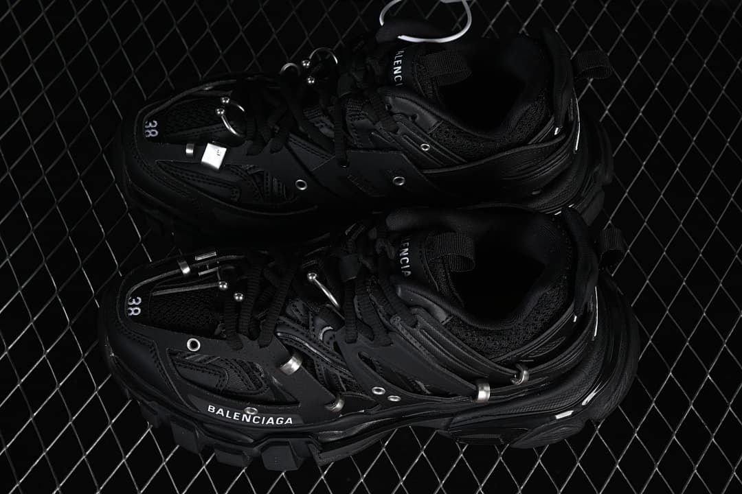 Pair of black Track Piercing sneakers viewed from above