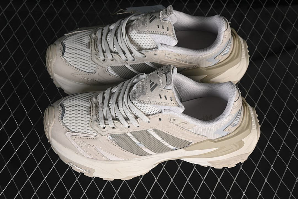 Pair of beige and gray XLG Storm Edge sneakers from above