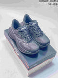 Pair of charcoal-gray Saucony Endorphin Speed 5 running shoes displayed on a shoebox