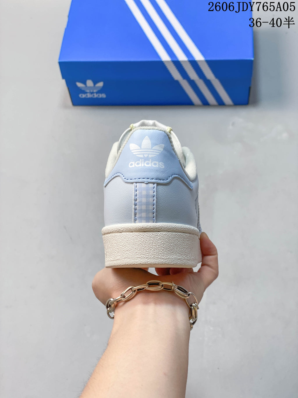 Rear view showing the heel panel and pale blue color
