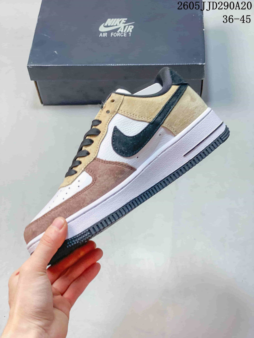 Side view of the low-top sneaker with layered panels and a dark swoosh