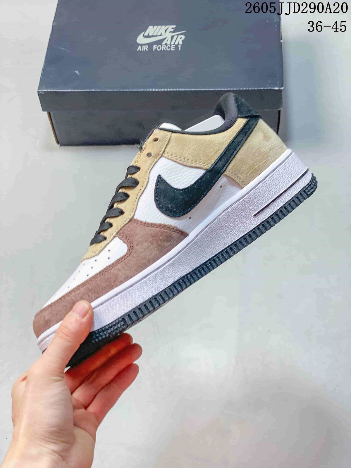 Side view of the low-top sneaker with layered panels and a dark swoosh