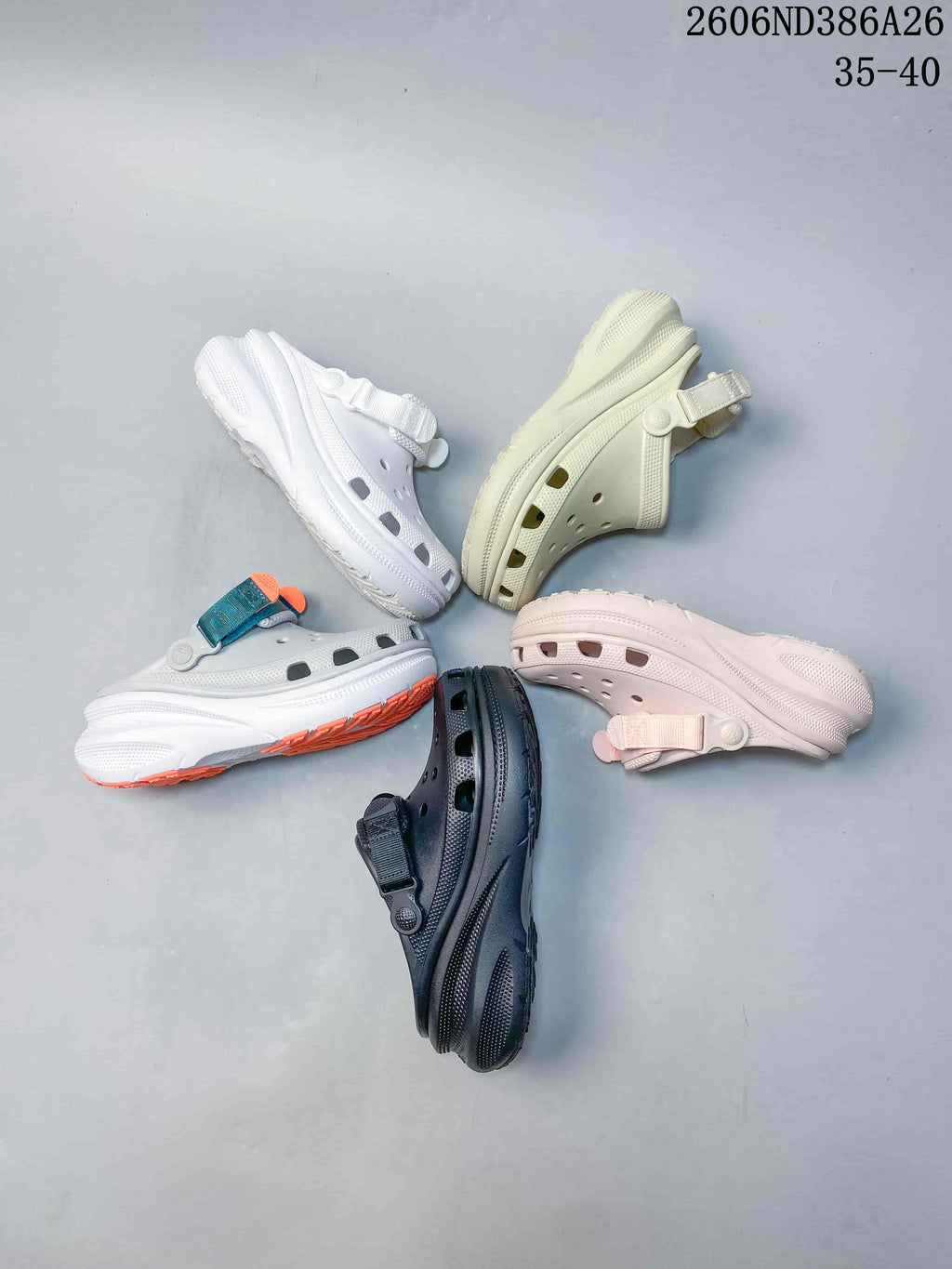Five clog sandals displayed in white, cream, pale pink, dark gray, and white with teal and orange accents