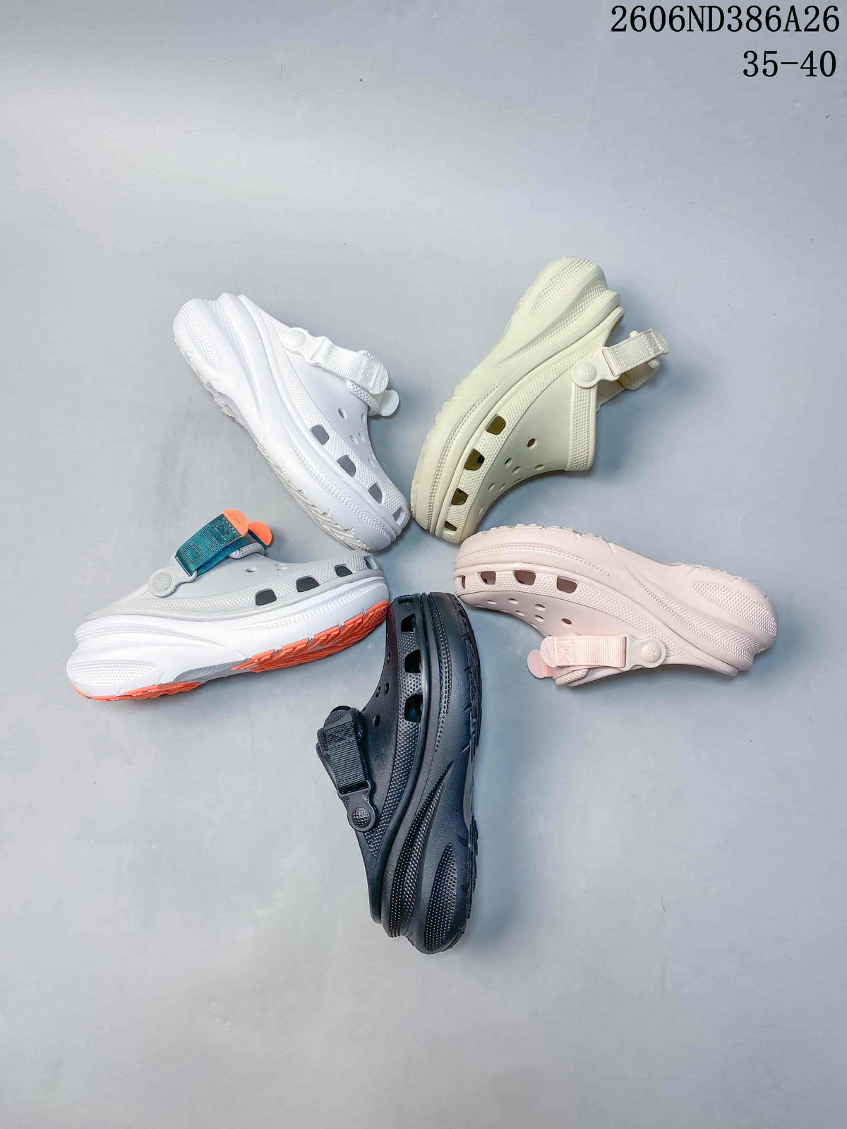 Five clog sandals displayed in white, cream, pale pink, dark gray, and white with teal and orange accents