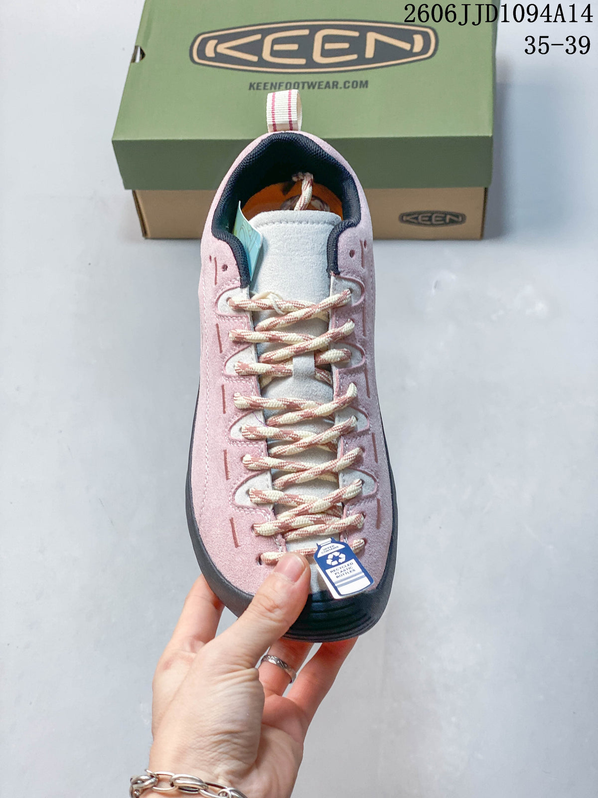 Top view of the sneaker showing its laces, tongue, and pink upper