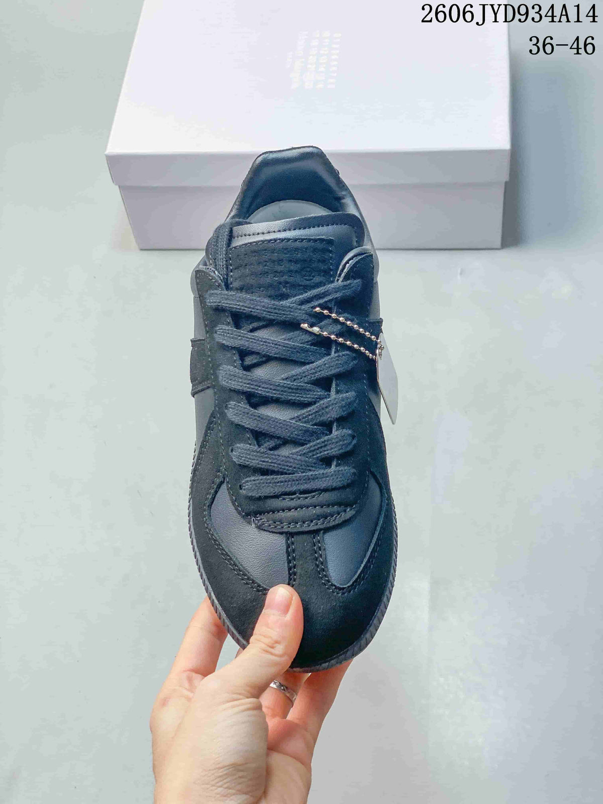 Front view of a dark navy sneaker with lace-up closure
