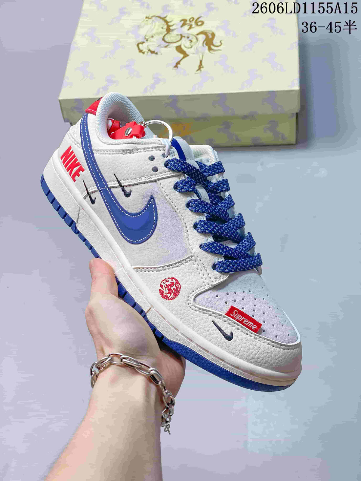 Close view of the sneaker's side, blue Swoosh, red details and blue laces