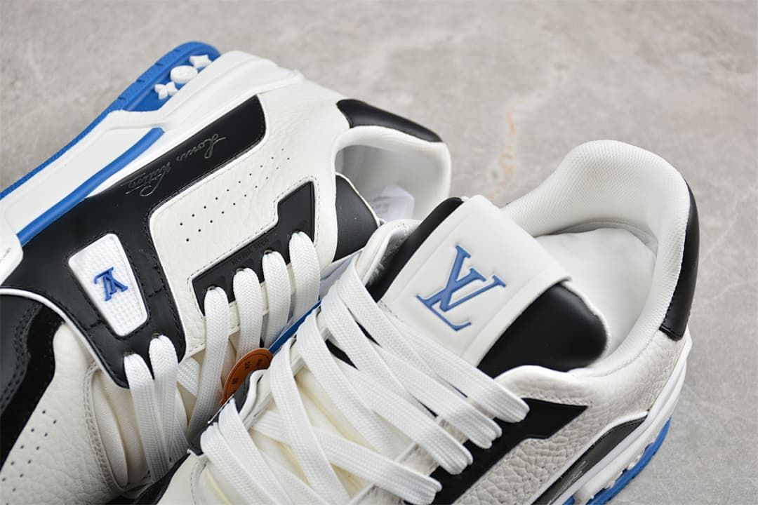 Close-up of the LV Trainer tongue, laces, and side details